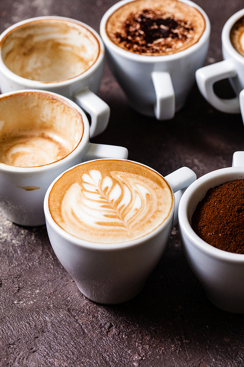 White cups of different stages of preparing cappuccino. Cofee lover concept still life