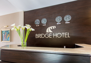 Hotel reception with desk and clocks