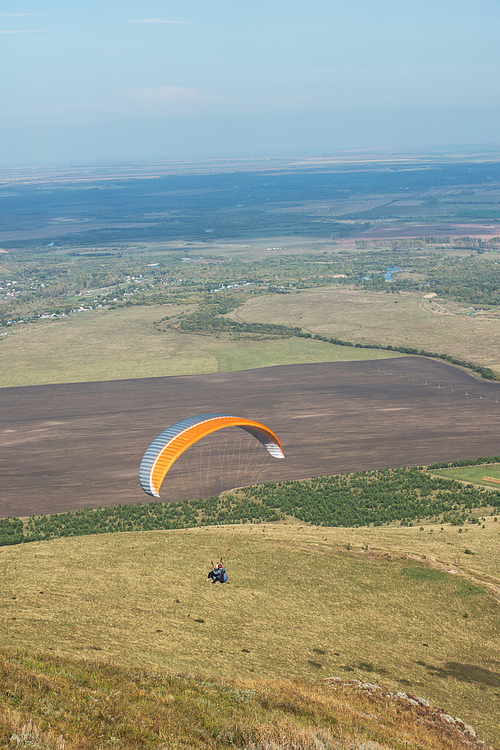 Paragliding in mountains. Para gliders in fight in the mountains, extreme sport activity.