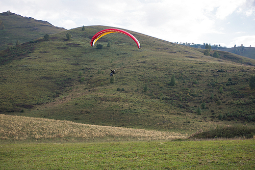 Paragliding in mountains. Para gliders in fight in the mountains, extreme sport activity.