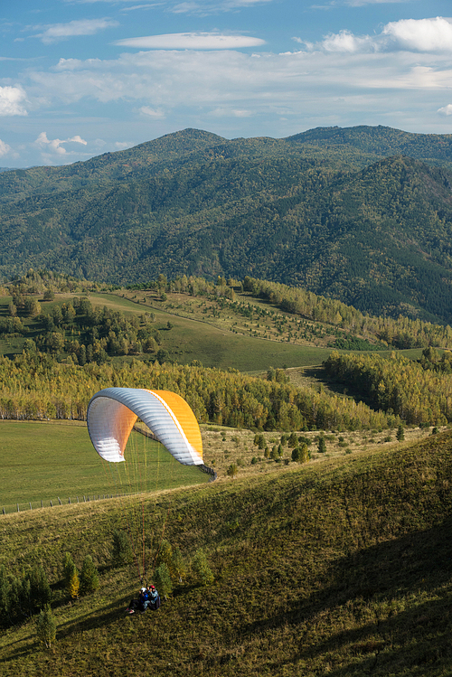 Paragliding in mountains. Para gliders in fight in the mountains, extreme sport activity.