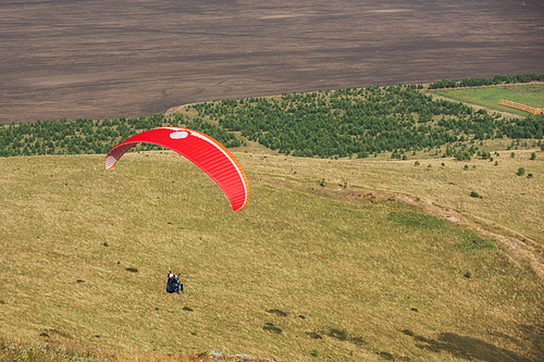 Paragliding in mountains. Para gliders in fight in the mountains, extreme sport activity.