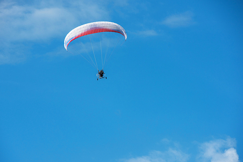 Paragliding in mountains. Para gliders in fight in the mountains, extreme sport activity.