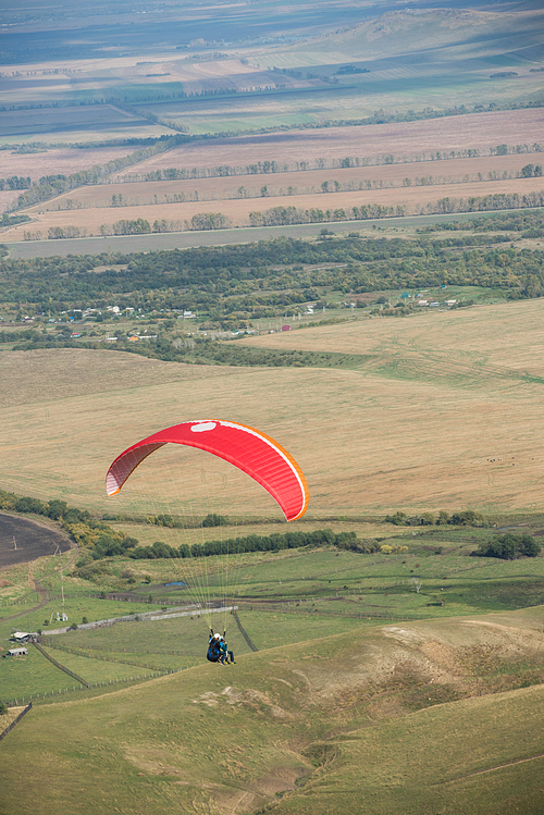 Paragliding in mountains. Para gliders in fight in the mountains, extreme sport activity.