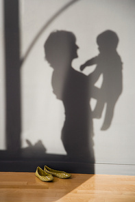 shadow of a woman holding a baby