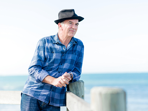 Portrait of an od man next to ocean