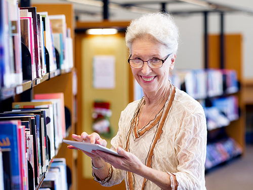 Elderly lady working with tablet