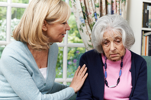 Mature Female Friend Comforting Unhappy Senior Woman