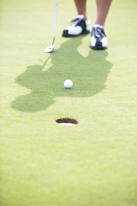 Low section of man playing golf