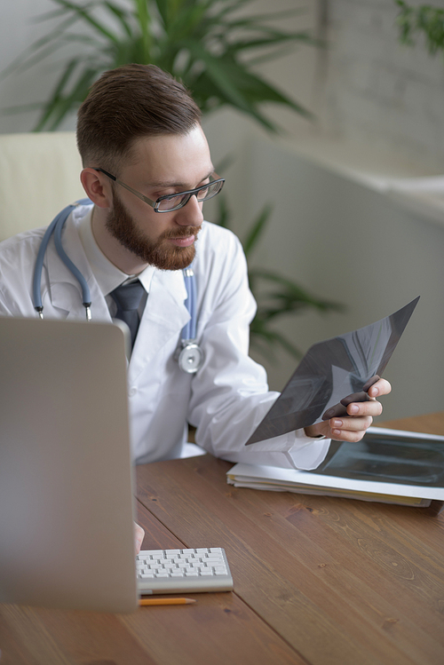 Doctor examining an elbow x-ray. Medicine and healthcare