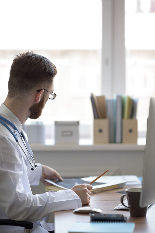 Doctor examining an elbow x-ray. Medicine and healthcare