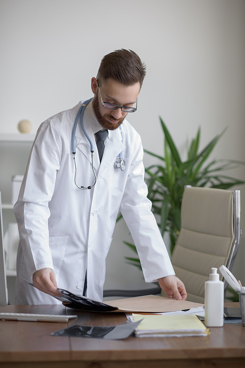 Doctor working with ct scan at hos workplace