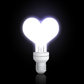 Glowing electrical light bulb on dark background