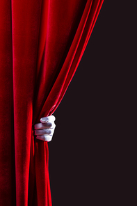 Close up of hand in white glove open the curtain. Place for text