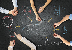 Top view of people hands drawing business strategy successful plan