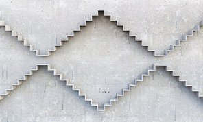 Concrete room with graph stair on wall going up