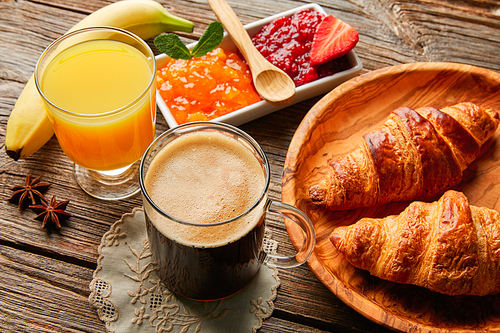 Breakfast continental with croissant coffe and orange juice