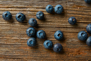 Blueberries fruits on a wooden board table background