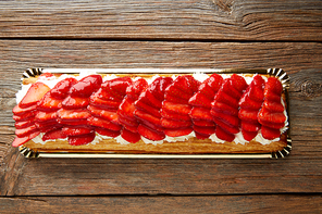 Strawberries puff pastry pie on wooden table