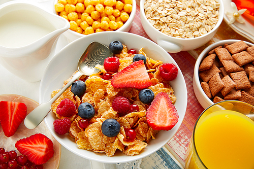 Breakfast healthy cereal coffee and orange juice with berries