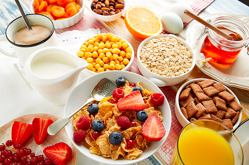Breakfast healthy cereal coffee and orange juice with berries