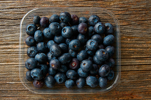 Blueberries fruits on a wooden board table background