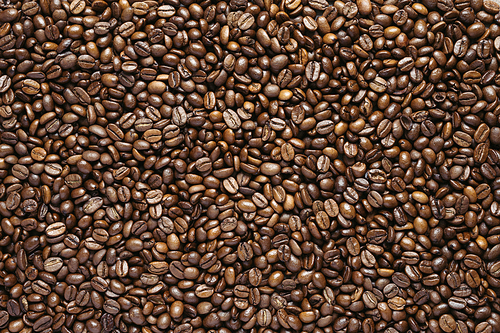 Roasted coffee beans closeup, can be used as a background, top view