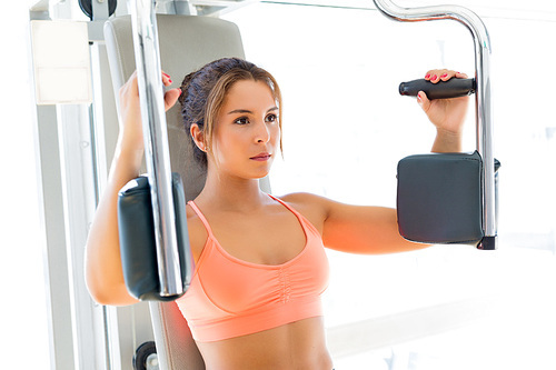 Young woman getting into shape with one more training session