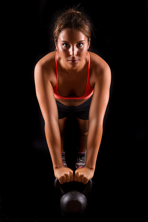 A beautiful young woman exercising - fitness concept