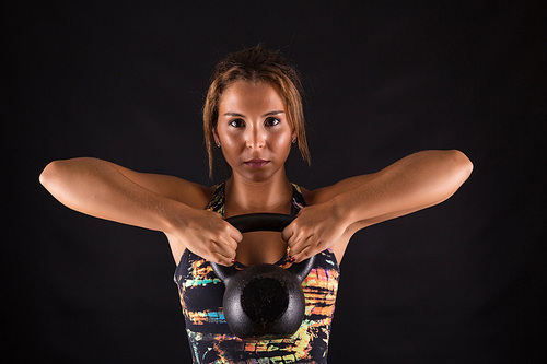 A beautiful young woman exercising - fitness concept