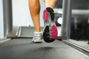 Image of female foot running on treadmill