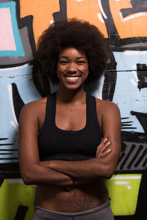 portrait of a young beautiful African American women in sports clothes after a workout at the gym