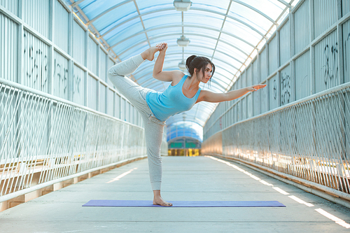 Beautiful Woman Practicing Yoga Outside On Bridge, Healthy Lifestyle Wellness Concept