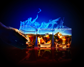 Image of three glasses of burning yellow absinthe