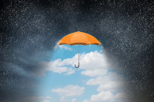 Conceptual image with color umbrella in sky under rain