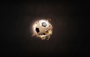 Conceptual image of football ball in fire flames