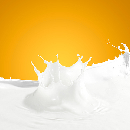 Pouring white milk splash on colour background