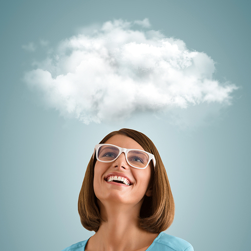 Positive woman looking at white cloud