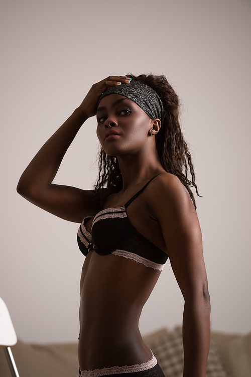 African model wearing black and pink lace lingerie set