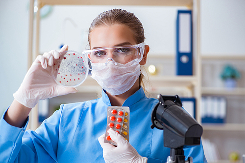 Female scientist researcher conducting an experiment in a laboratory