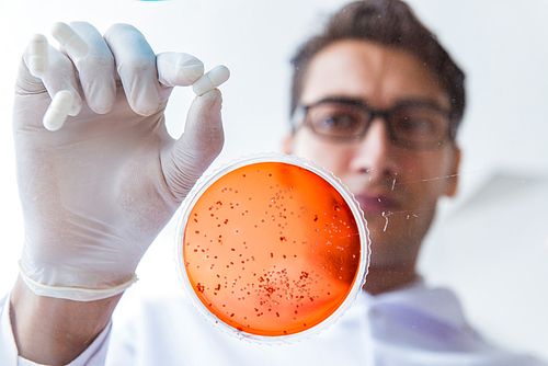 Chemist working in the laboratory with hazardous chemicals