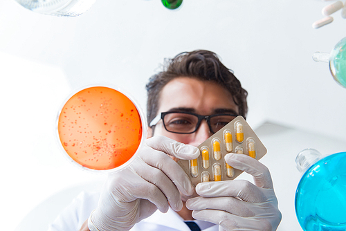 Chemist working in the laboratory with hazardous chemicals