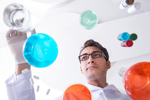 Chemist working in the laboratory with hazardous chemicals