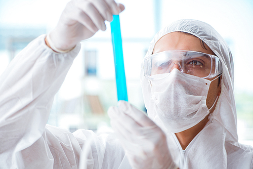 Chemist working in the laboratory with hazardous chemicals