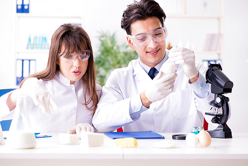 Two lab doctor testing food products