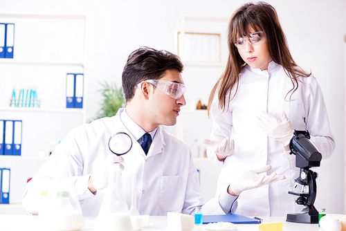 Two lab doctor testing food products