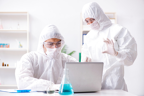 Two chemists working in the lab