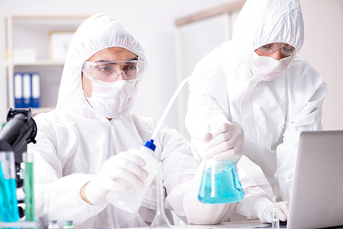 Two chemists working in the lab