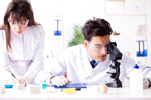 Two lab doctor testing food products