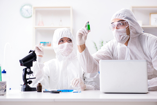 Two chemists working in the lab